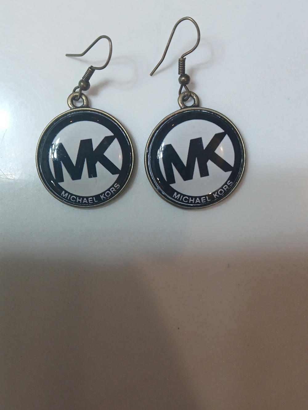 Michael Kors round logo dangle earrings feature the brand's iconic "MK" monogram - Picture 2 of 8